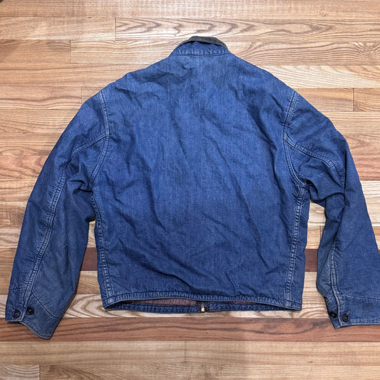 Blue denim jacket on a wooden floor