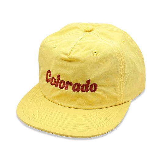 Yellow cap with 'Colorado' text on a white background